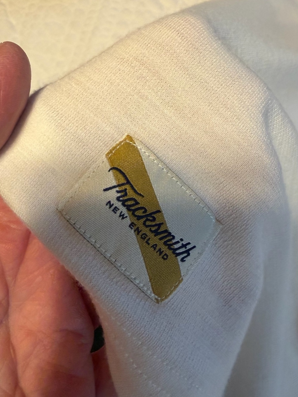 Tracksmith White Tee with Gold and Navy Logo Patch